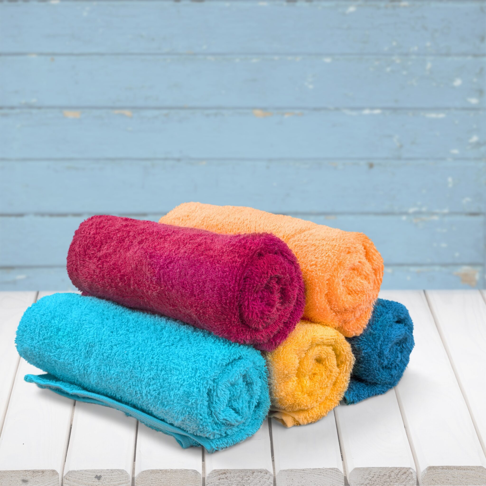 pile of fluffy towels on background